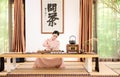 A woman with a teapot-China tea ceremony