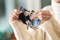 Woman tearing up photo of happy couple, closeup. Concept of divorce Royalty Free Stock Photo