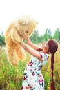 Woman with a Teddy bear in nature Royalty Free Stock Photo