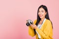 Woman teen excited smiling holding vintage photo camera Royalty Free Stock Photo