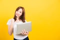 Woman teen smile standing wear t-shirt hold laptop computer and excited celebrating success