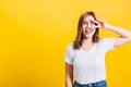 Woman teen smile standing wear t-shirt showing finger making v-sign symbol near eye Royalty Free Stock Photo