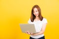 woman teen smiling standing wear t-shirt using laptop computer on hand Royalty Free Stock Photo