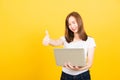 Woman teen smiling standing wear t-shirt using laptop computer and showing thumb up Royalty Free Stock Photo