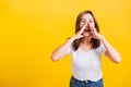 Woman teen standing big shout out with hands next mouth giving excited positive