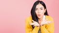 Woman teen standing blowing kiss air something on palm Royalty Free Stock Photo