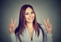 Woman or teenage girl showing peace hand sign with both hands Royalty Free Stock Photo