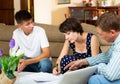 Woman with teenage son signing papers Royalty Free Stock Photo