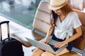 Woman teenager using laptop computer airport Royalty Free Stock Photo