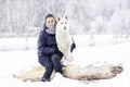 Woman tenderly hugging a dog