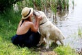 Woman Tenderly Hugging and Kissing Pet Dog