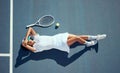 Woman tennis athlete tired and exhausted after training, exercise or practice for a game. Female professional loss of Royalty Free Stock Photo