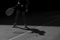 Woman tennis player in action. Black and white