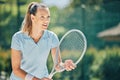 Woman, tennis player and racket ready in sports game for ball, match or hobby with smile on court. Happy female in sport Royalty Free Stock Photo