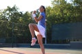 Woman tennis player showing yes gesture after winning point, successful game