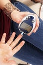 Woman testing her blood sugar Royalty Free Stock Photo