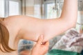 Woman is testing her muscle under her arm Royalty Free Stock Photo