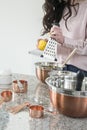 Woman testing a lemon in the kitchen Royalty Free Stock Photo