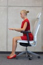 Woman testing office chair