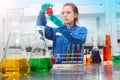 Woman testing solution chemical analysis laboratory chemistry industry Royalty Free Stock Photo