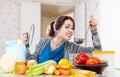 Woman tests food with ladle