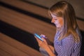 Woman texting. Closeup young happy smiling cheerful beautiful woman looking at mobile cell phone reading sending sms Royalty Free Stock Photo