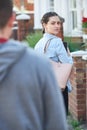 Young Woman Texting For Help On Mobile Phone Whilst Being Stalke