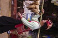 Woman Thai in Dien Bien market selling shoots of b