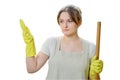 A woman in think throws up her hands while cleaning in the home kitch