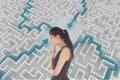 Woman thinking against background with a maze Royalty Free Stock Photo