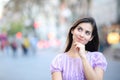 Woman thinking looking at side in the street Royalty Free Stock Photo