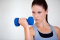 Woman, thinking or serious with dumbbells in studio, health wellness or fitness for weight loss with exercise. Young Royalty Free Stock Photo