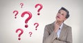 Woman thinking with shiny pink question marks