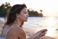 Woman, thinking with view on beach and travel for wellness, fresh air and sunset, ocean and holiday in Bali. Reflection Royalty Free Stock Photo