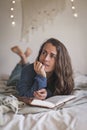 Woman thinking about what to write in her diary Royalty Free Stock Photo