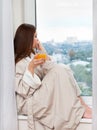 Woman thinking at the window. Royalty Free Stock Photo