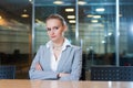 Woman thoughtfully looking aside in meeting room Royalty Free Stock Photo