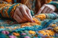 a woman threading the stitches of a stitched quilt