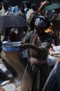 Lalibela, Wollo, Ethiopia, circa February 2007: Woman threshing teff