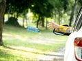 The woman threw a plastic water bottle after drinking all the water into the park area Royalty Free Stock Photo