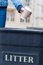 Close Up Of Woman Throwing Away Takeaway Coffee Cup In Trash Bin