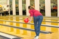 woman throwing ball in bowling club Royalty Free Stock Photo