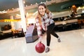 Woman throwing bowling ball Royalty Free Stock Photo