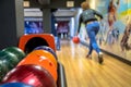 Woman throwing bowling ball Royalty Free Stock Photo