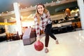 Woman throwing bowling ball Royalty Free Stock Photo