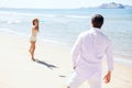 Woman throwing a flying disc at the beach Royalty Free Stock Photo