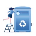 Woman throwing plastic garbage in the big trash can. Separate collection and recycling of garbage. Steel recycled waste container