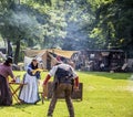 Fight scene re-enactment.Woman throws beer over cowboy.