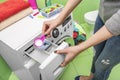 Woman throws laundry detergent into the washing machine. Royalty Free Stock Photo