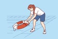 Woman throws lifebuoy into pool to help drowning or non-swimmer who has fallen into water Royalty Free Stock Photo